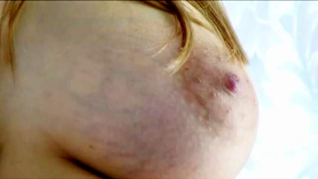 Petite and pregnant Knocked Up Nina is showing her big tits