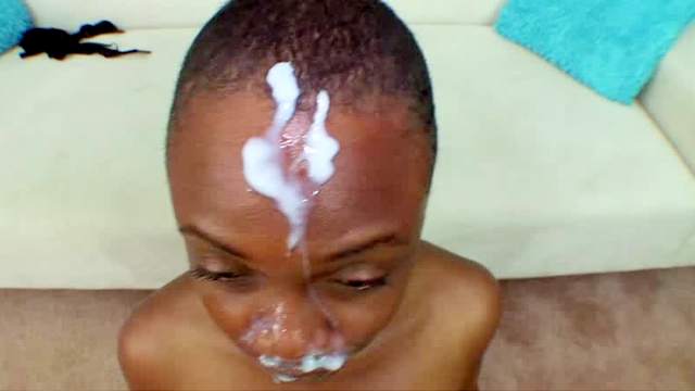 Shaved head black girl sucks to facial