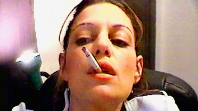 She smokes close up on webcam