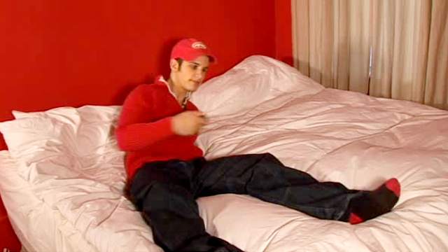 Solo gay Pierre Fitch is showing his huge dick on the bed