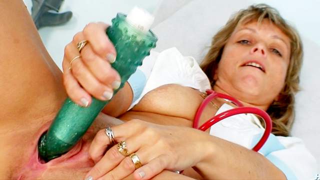 Nurse pussy finds pleasure in a dildo