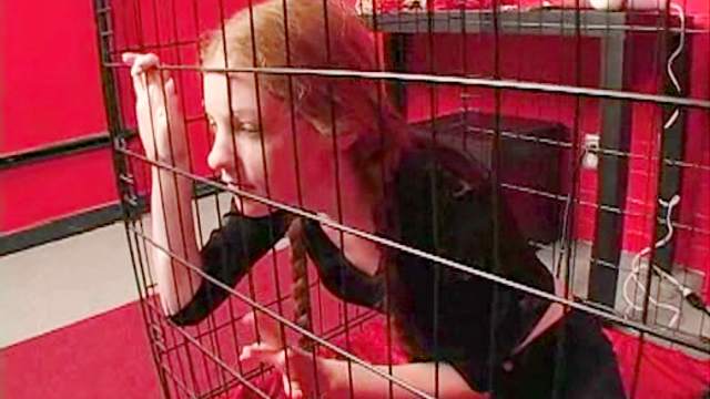 Teen redhead in pigtails caged by mistress