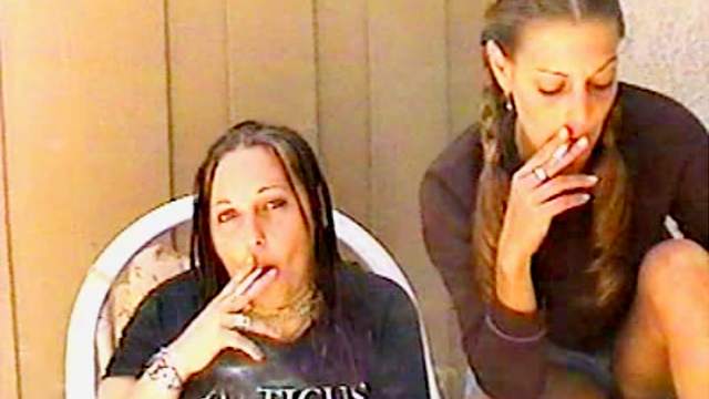 Women smoke and talk to the camera