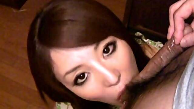 As Rika Tamura's sensual Asian eyes gaze into yours, her expert tongue worships your balls