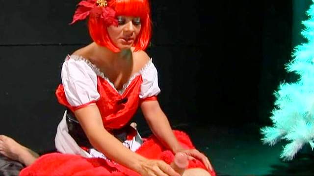 Costume girl in red wig sucks a dick