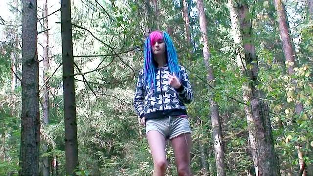 Blue haired cutie pissing outdoors