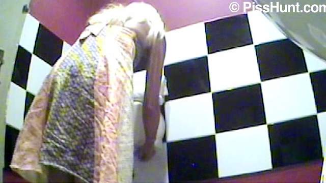 Blonde pees in a public bathroom