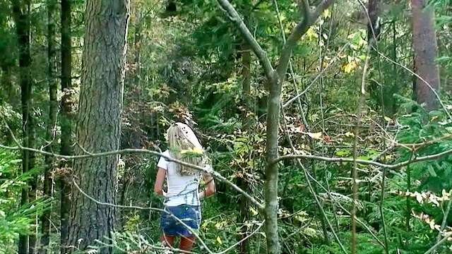 Shaved pussy pissing in the woods