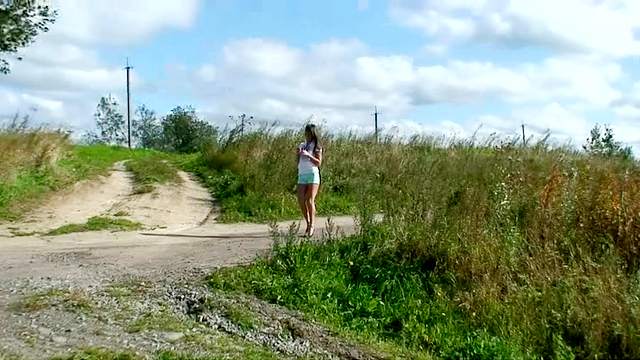 Short shorts girl pissing in the dirt