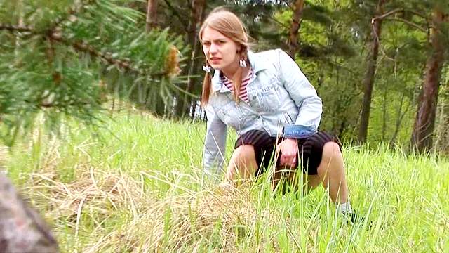 Teen in tights and pigtails pisses outdoors