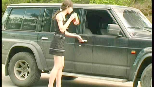 Smoking chick pissing outside her car