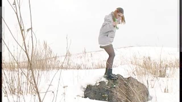 Pigtailed girl pissing in the snow