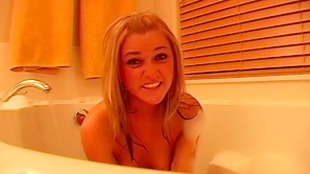 Cute blonde in bathtub has small tits