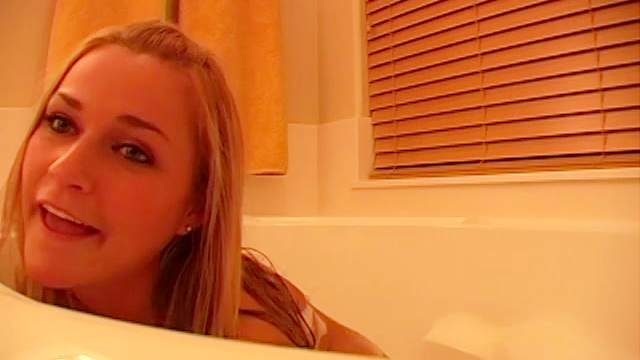 Cute blonde in bathtub has small tits