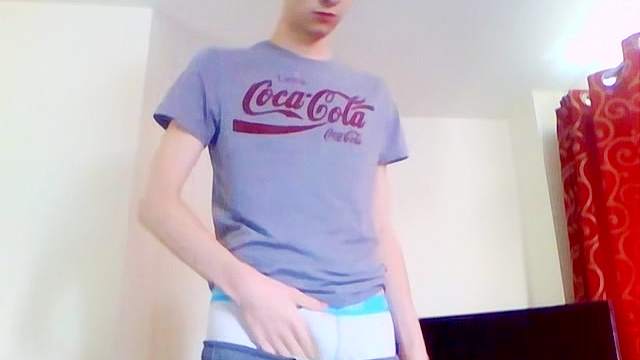 Wide eyed solo teen boy jerks off