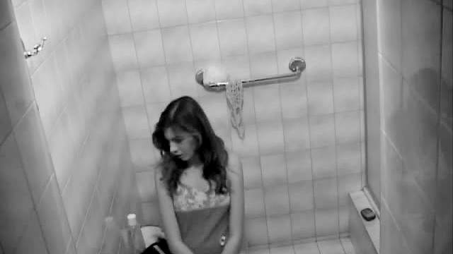 Voyeur teen striptease in bathroom