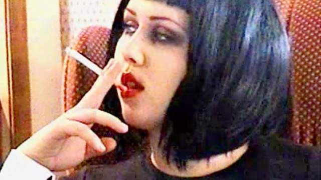 Goth girls smoking in fetish video