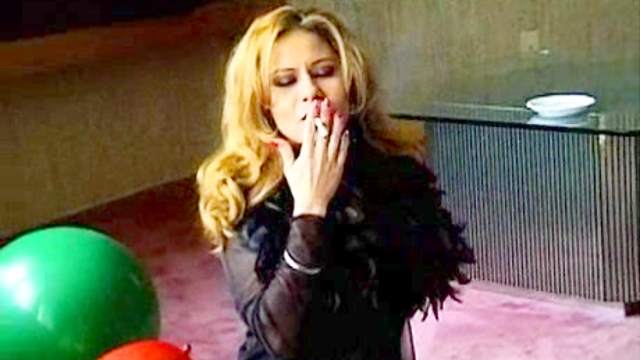 Balloon popping girl smokes cigarettes