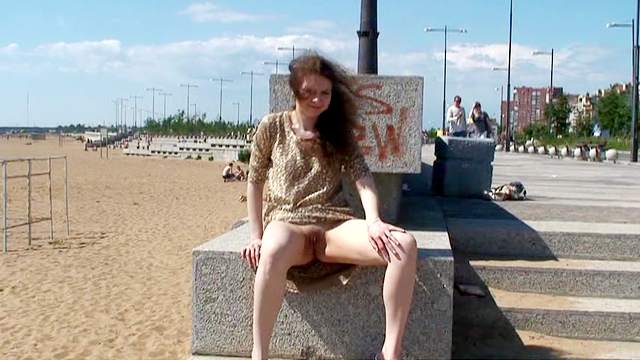 Girl in a dress flashes her pussy