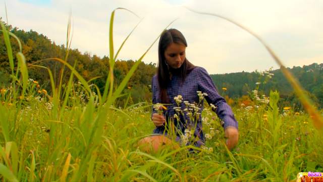 Gloria posing on the sexy green field!