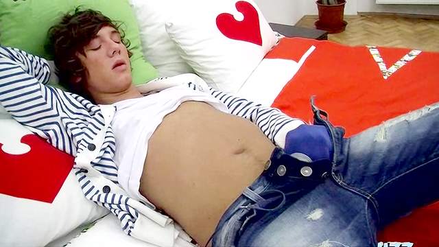 Eros Christian lying on the bed and masturbating his cute cock