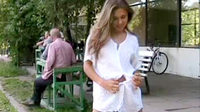 nice looking cutie Olga undressing herself in a public place