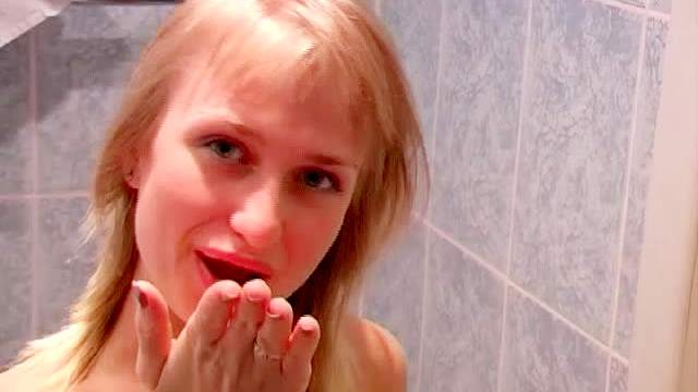 Blonde Luba pissing in the toilet