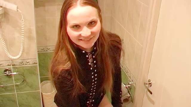 Kate pissing in the toilet