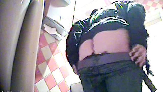 Horny amateur brunette pissing in the toilet