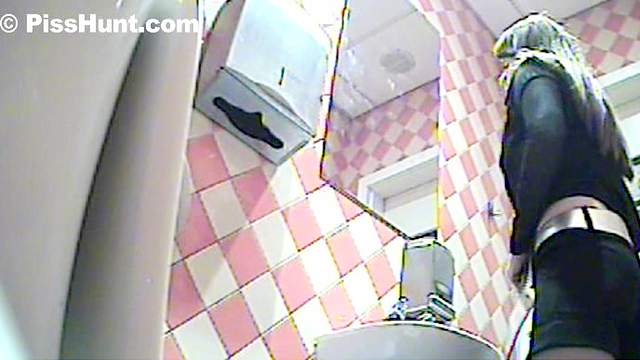Busty woman is pissing with pleasure