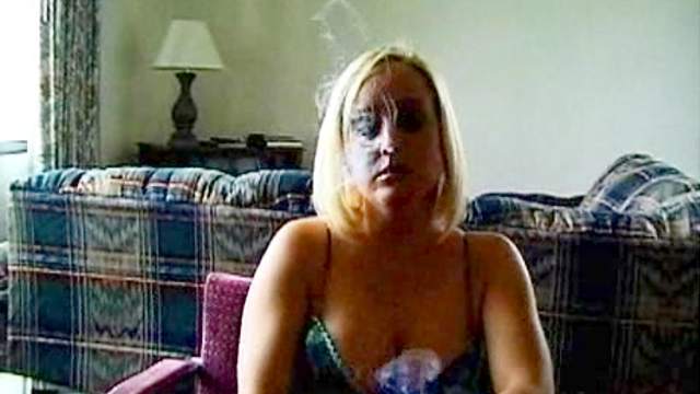 Sweet blonde is smoking in a sexy hot way