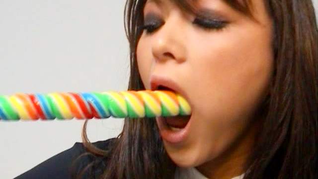 Curly brunette Natalia Forrest is sucking tasty candy