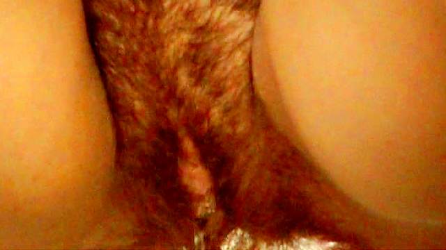 Slender babe with hairy pussy is peeing