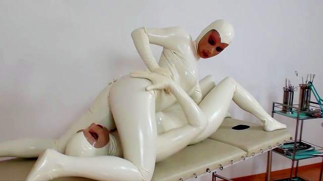 Agate and Tanja are dressed in pretty white latex