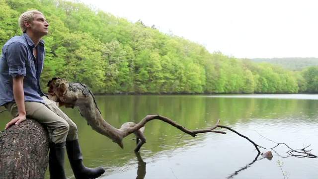 Hot blond gay Max Carter is masturbating while sitting