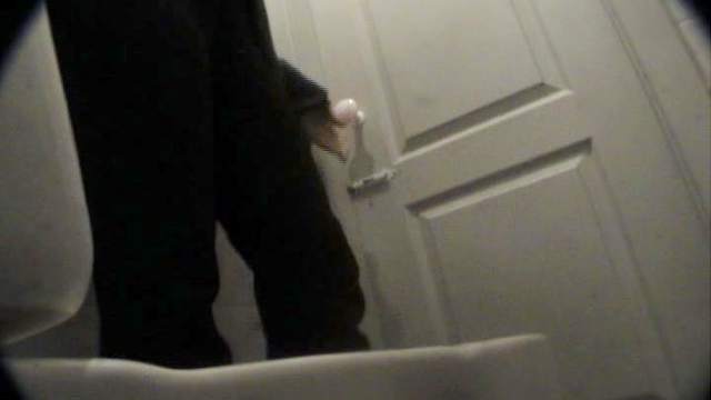 Cute busty babe is peeing in the public toilet