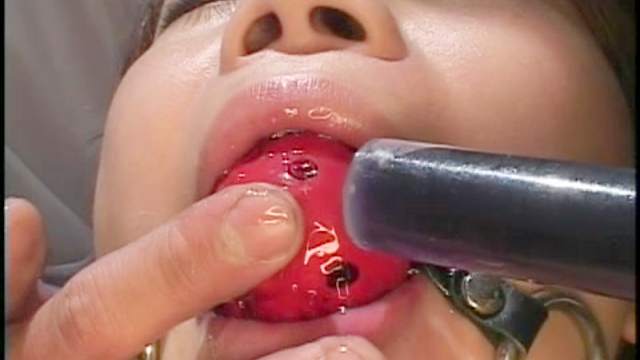 Cute Asian babe with gag in mouth gets sperm