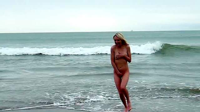 Spicy blonde Jeanie Marie Sullivan is sucking on the beach