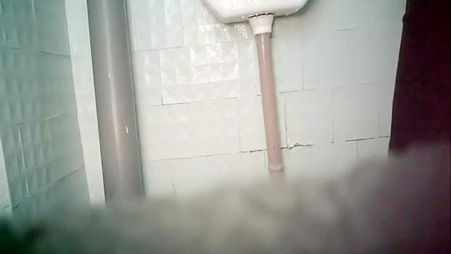 Pretty beauty is poking her puss in the toilet