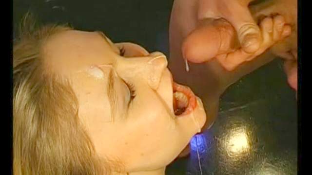 Busty blonde swallows a glass of jizz