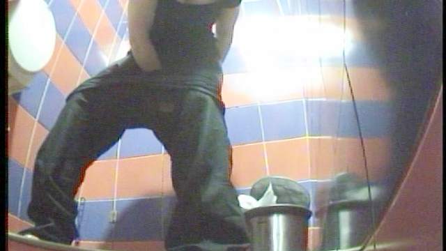 Nasty curly brunette is peeing in a sexy toilet