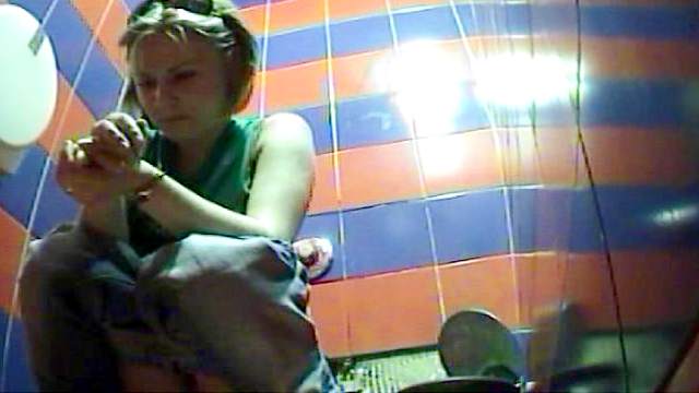 Gorgeous blonde is sitting and peeing on the cam