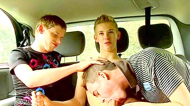 Gorgeous gay sucks two dicks in the car