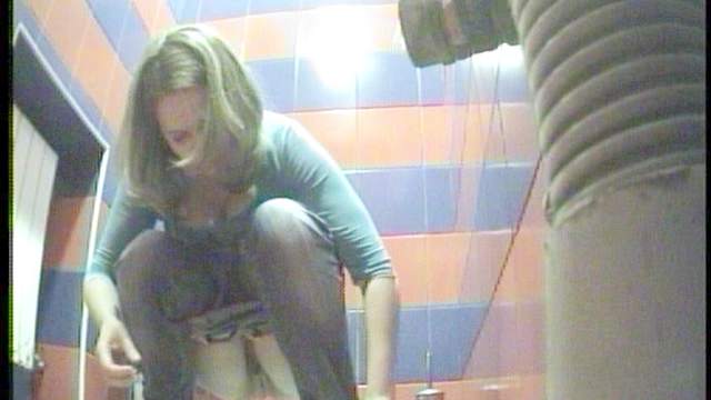 Hot babe is peeing in close-up scene on camera