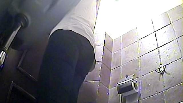 Gorgeous beauty is peeing in the public toilet