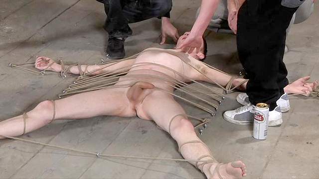 Slender tied dude is playing with his hard shaft