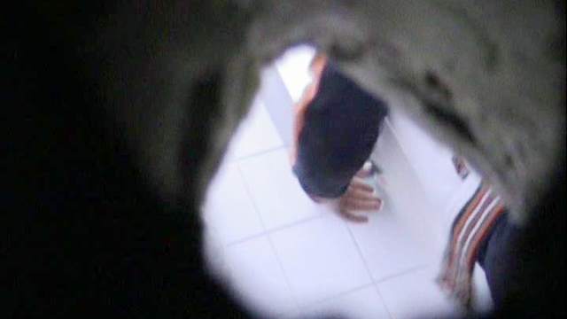 She is peeing on the cam through the hole