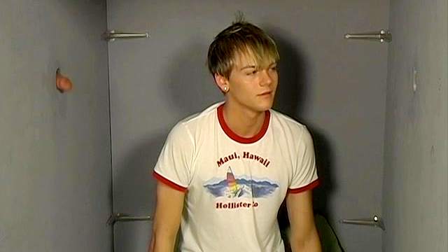 Perverted dude sucks a dick through the hole