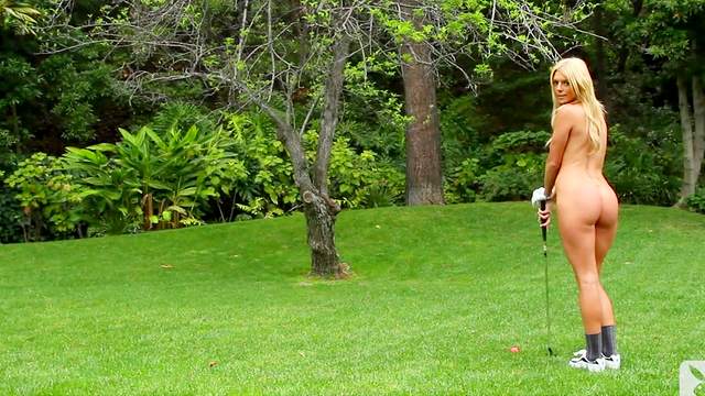 Jessica Marie Love poses on the green field of grass